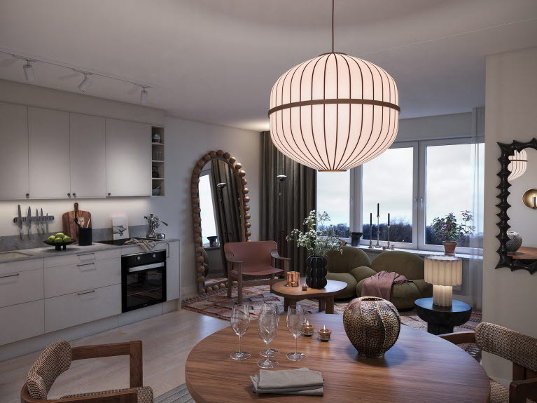 Visionsbild kök och vardagsrum i Årstabergi en nyproducera